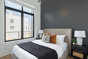 Bedroom 2 features a queen bed.