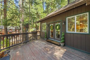 Sip your morning coffee on the front deck and take in the peaceful, woodsy charm of Sierra Park—double doors open wide for fresh mountain air.