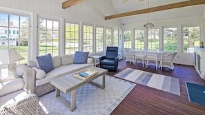 Wonderful screened-in porch with sitting area and dining table