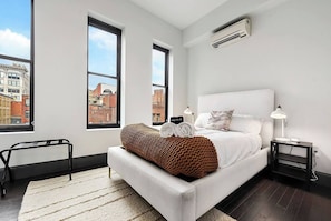 A queen-size bed in a cozy room.