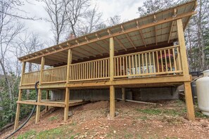 A view of the covered deck at Boogie Bear, a 1-bedroom cabin rental located in Gatlinburg