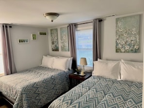 Bedroom 2 has two full-size beds (sleeps 4 people)