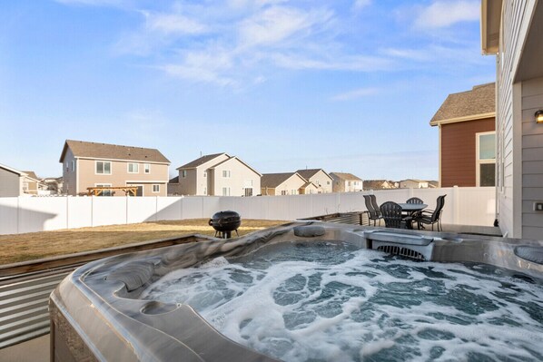 Private Hot tub and a large fenced back yard
