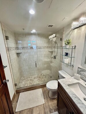 Master Bath has a roomy all glass walk in shower.