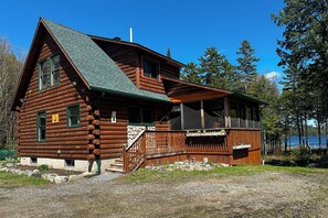 Full log cabin with mini split heat pump for heating and cooling.