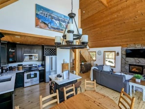 Kitchen with island and dining table that seats up to 8