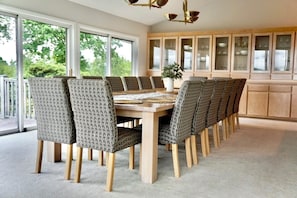 Dining Room 1: Gather around the stunning table, perfect for unforgettable meals and memories!