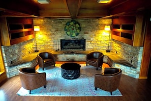 Living Room 2: Gather around the stunning stone fireplace for unforgettable moments and laughter!