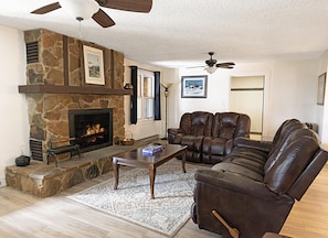 The first floor living room has a wood burning fireplace and is a comfortable place to relax!