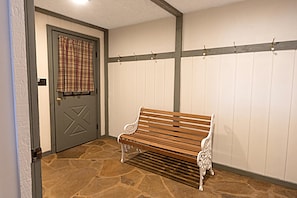 The spacious mud room on the first floor — the perfect spot to keep your ski equipment, bikes, and other gear.