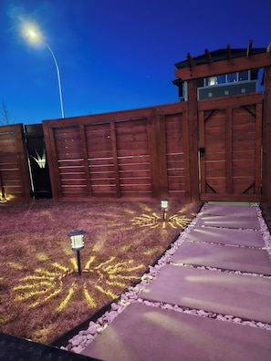 Lit up entrance way for evening arrivals. The light will always be on for you!