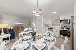 Gather around the table for a meal, a laugh, in our warm dining space.