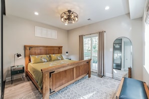 Bedroom sliding door leads to back patio.