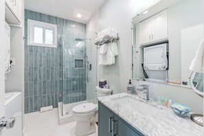 Pristine shower featuring a rainfall shower head.
