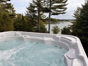 Relax in the hot tub while gazing at the sunset or looking up at the stars
