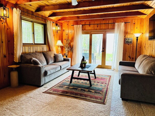 Rustic Vibe Living Room with Walkout to the Porch and Lake Superior Views.