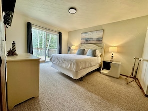 Queen Bedroom with a walkout porch and view of Lake Superior