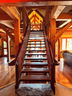 Handcrafted staircase inside front entry