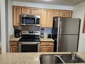 Full kitchen and kitchen amenities. Kitchen utensils and dishware provided.