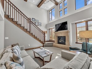 Living room 1: Main floor, gas fireplace, Smart TV, patio access