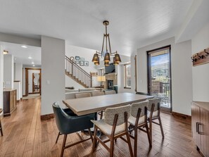 Dining area: Main floor, table seating for 8, bar seating for 3, private patio access