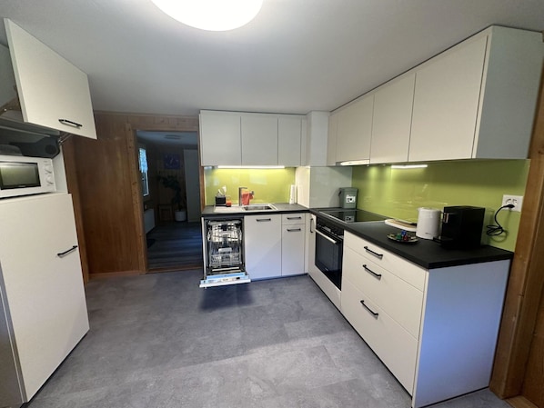 Cabinetry, Building, Property, Countertop, Lighting, Interior Design, Drawer, Flooring, Floor, Kitchen Appliance