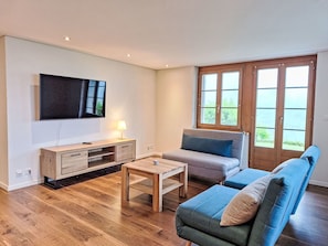 Furniture, Interior Design, Flooring, Floor, Wood, Room, Couch, Wood Flooring, Table, Living Room