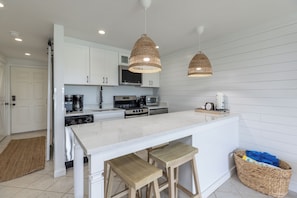 Coastal charm meets modern comfort in this bright and breezy kitchen