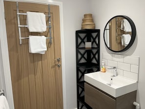 Bathroom with toilet, sink, bath & shower cubicle.