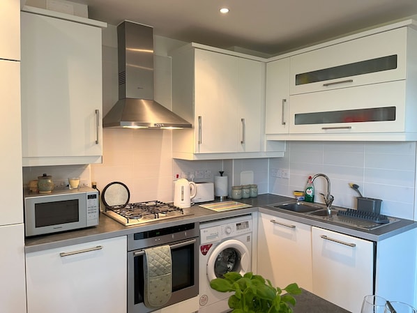 Kitchen with appliances and plenty of utencils