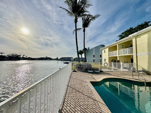Whether you're diving in for a refreshing swim, relaxing poolside on one of the lounge chairs, or enjoying the warmth of the sun as you read a book, this space is designed for ultimate relaxation. 
