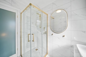 Modern bathroom with a sleek glass shower and elegant fixtures