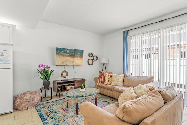 Curl up in the cozy living room & stream your favorites on the smart TV