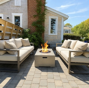A fire pit area with climbing hydrangea.