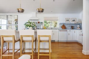 Large marble island with seating for 3.
