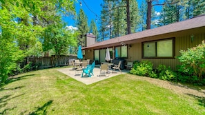 Private fenced yard under the pines