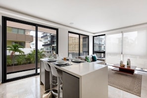 Floor-to-ceiling windows flood this kitchen with light.