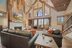Vaulted Ceilings, Wood Floors and Leather Sofas