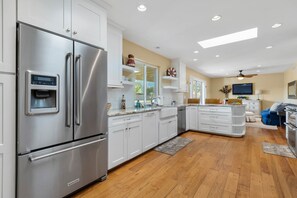 Fully Equipped Modern Kitchen with Stainless Steel Appliances and Stone Counters