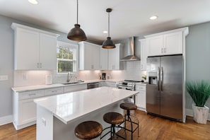 Large, spacious kitchen island. Plenty of room to make the perfect meal!