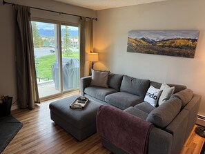 Views of mountains from large comfortable living room sofa.