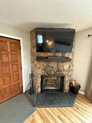 Hi-def bluetooth TV with cable and streaming channels. Wood burning fireplace.
