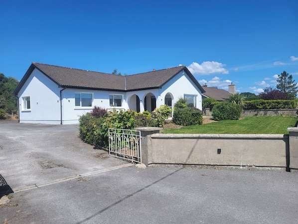 Large 4 bedroom bungalow with extensive gardens. Ample parking space
