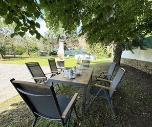 Furniture, Chair, Outdoor Furniture, Table, Outdoor Table, Kitchen & Dining Room Table, Shade, Restaurant, Garden, Patio