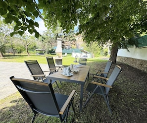 Furniture, Chair, Outdoor Furniture, Table, Outdoor Table, Kitchen & Dining Room Table, Shade, Restaurant, Garden, Patio