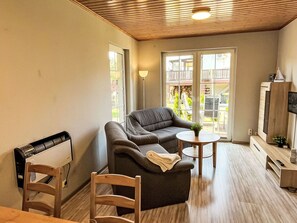 Furniture, Flooring, Floor, Interior Design, Wood, Wood Flooring, Living Room, Couch, Room, Table