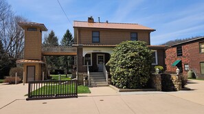 Front of home with bike rack, access to bungalow and glamping areas