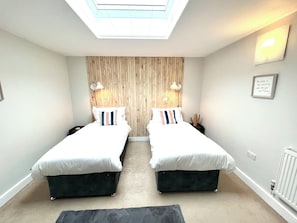 Twin Room: Enjoy light-filled elegance with trendy decor and playful touches for your perfect getaway!