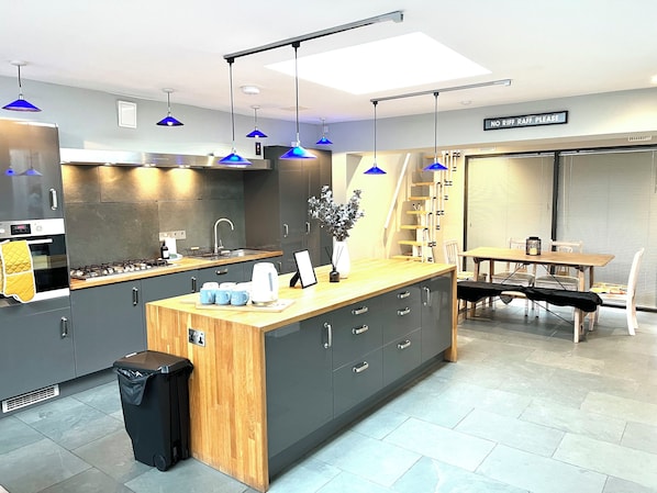 Kitchen: Modern design with sleek finishes and vibrant lighting for delightful culinary moments!