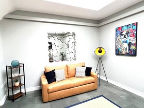 Lounge: Artistic decor and natural light create a vibrant space to unwind and socialize!